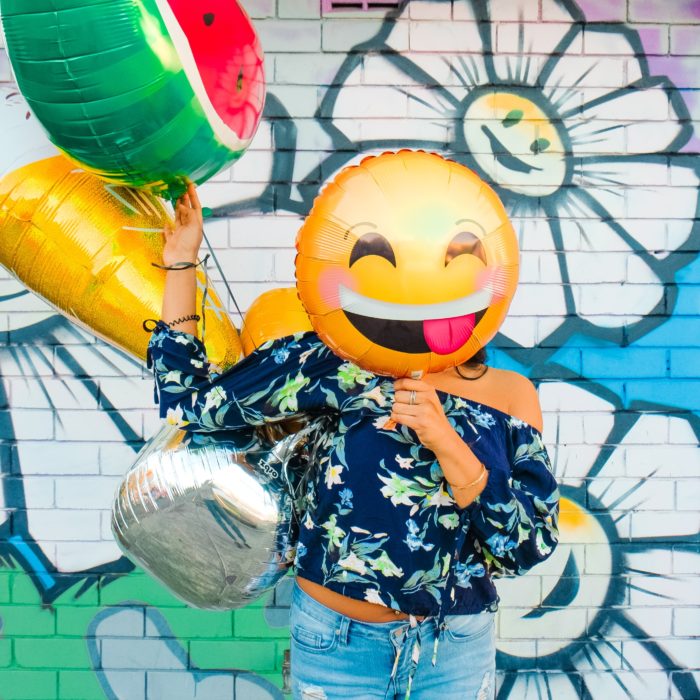 Woman with Emoji Balloon