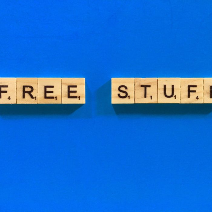 free stuff words on wooden block with blue background