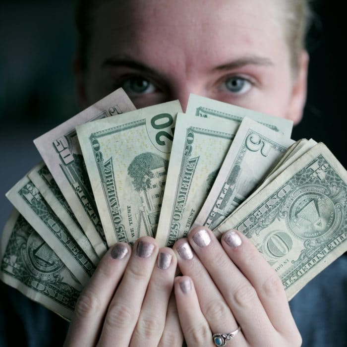 woman holding money