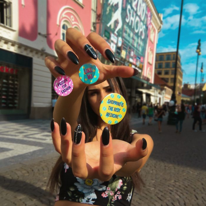 girl doing magic trick with badges