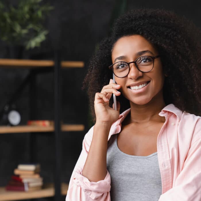 Student talking on smart phone cellphone with good connection at home