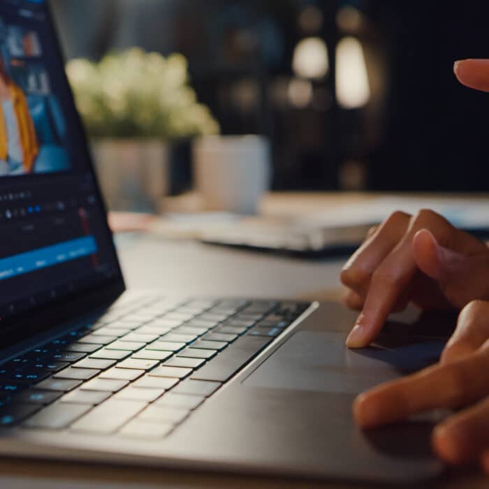 Person using a laptop with the screen showing