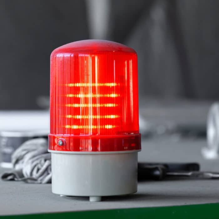 Warning light alarm in industrial plant close up